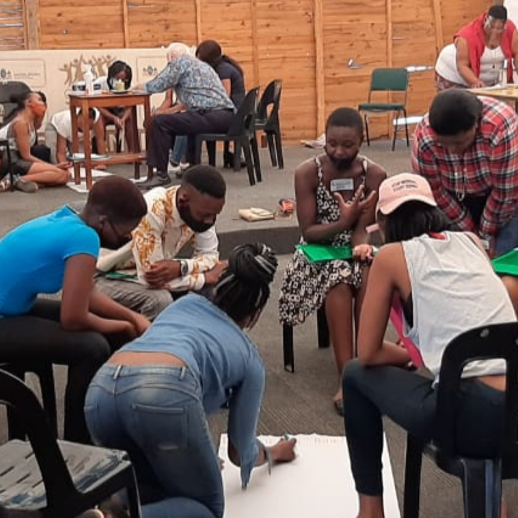 Participants engaging in inner healing activities during the Creators or Peace workshops in Johannesburg. 