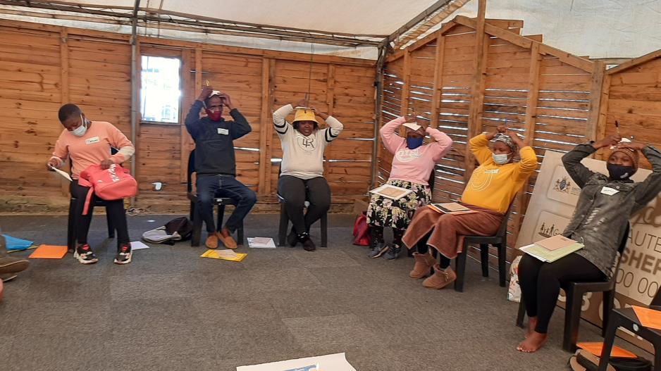 Participants engaging in inner healing activities during the Creators or Peace workshops in Johannesburg. 